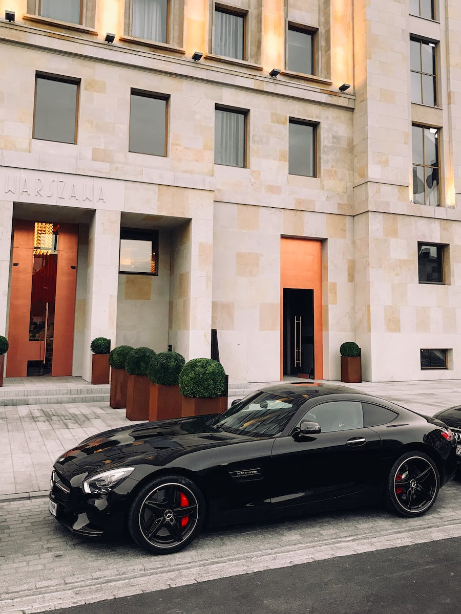 Black Coupe Parked In Front Of Building