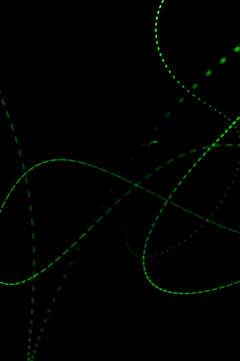 a black background with green lines and dots