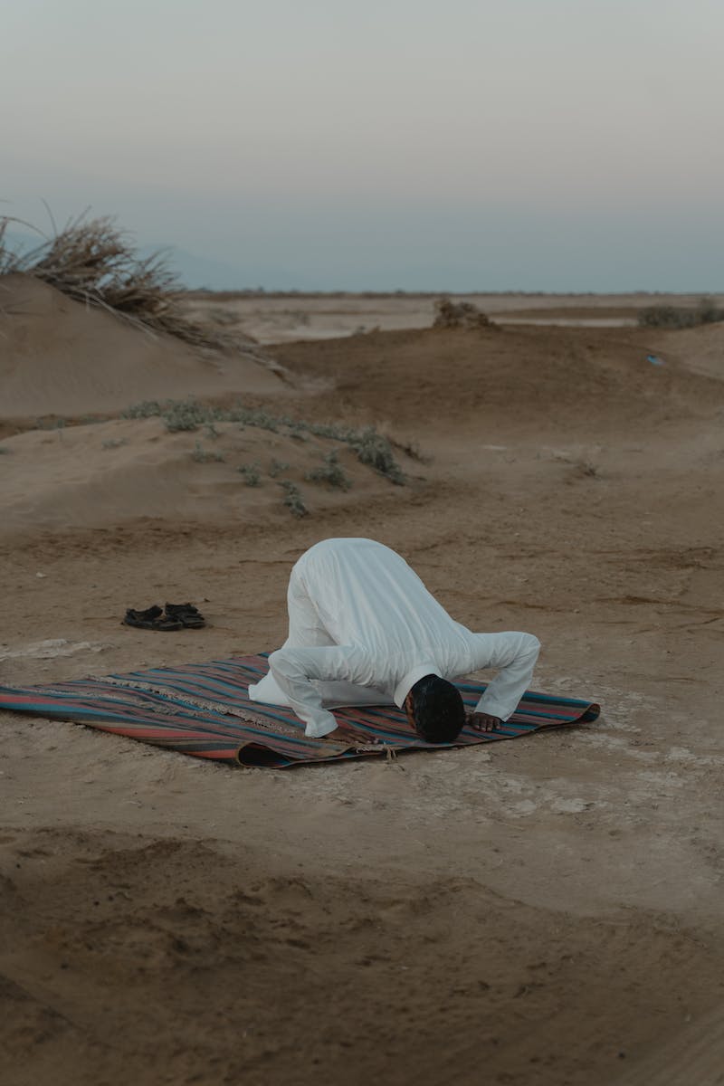 Photo Of Man Praying During Dawn