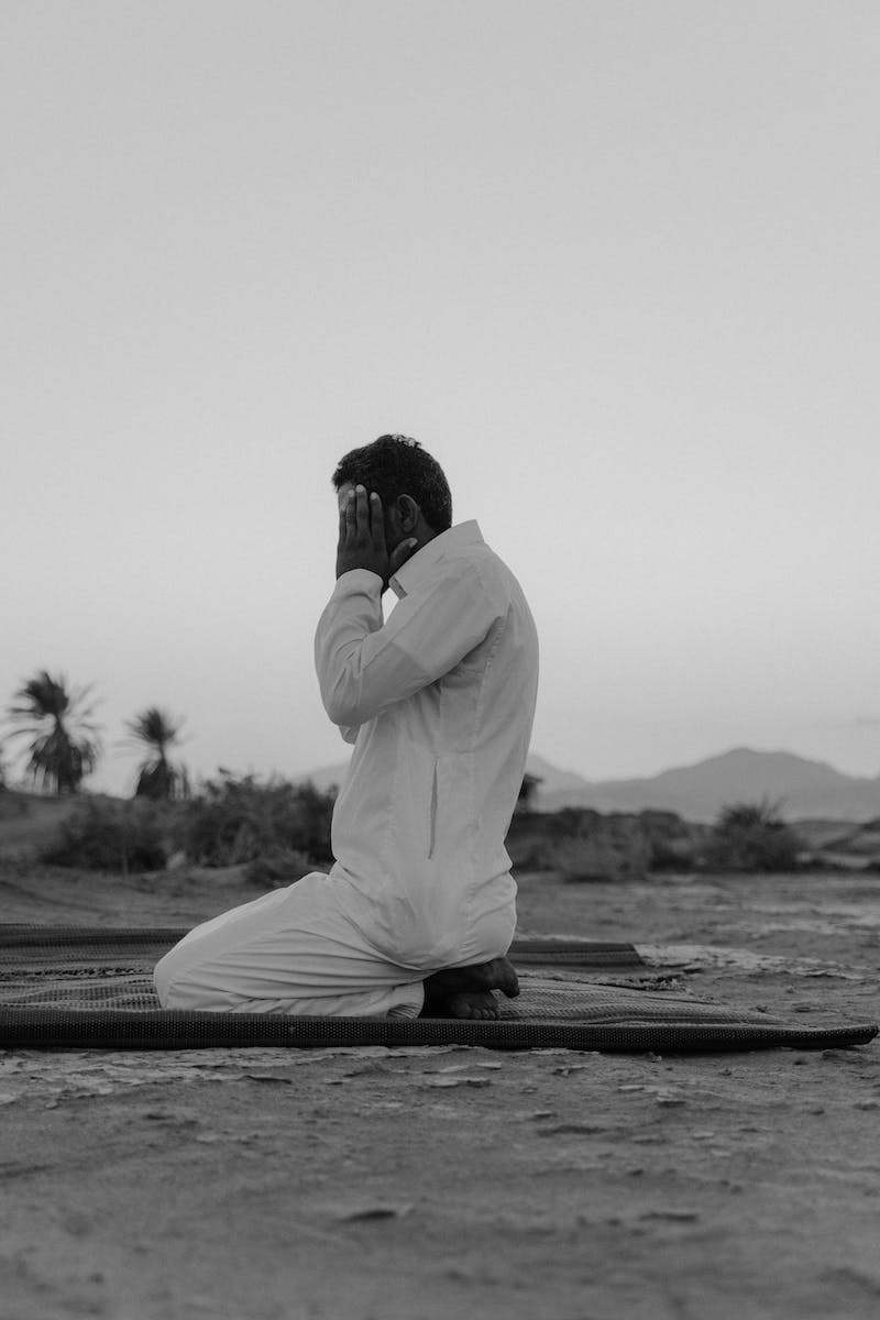 Monochrome Photo Of Man Praying