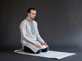 Man Kneeling on a Carpet