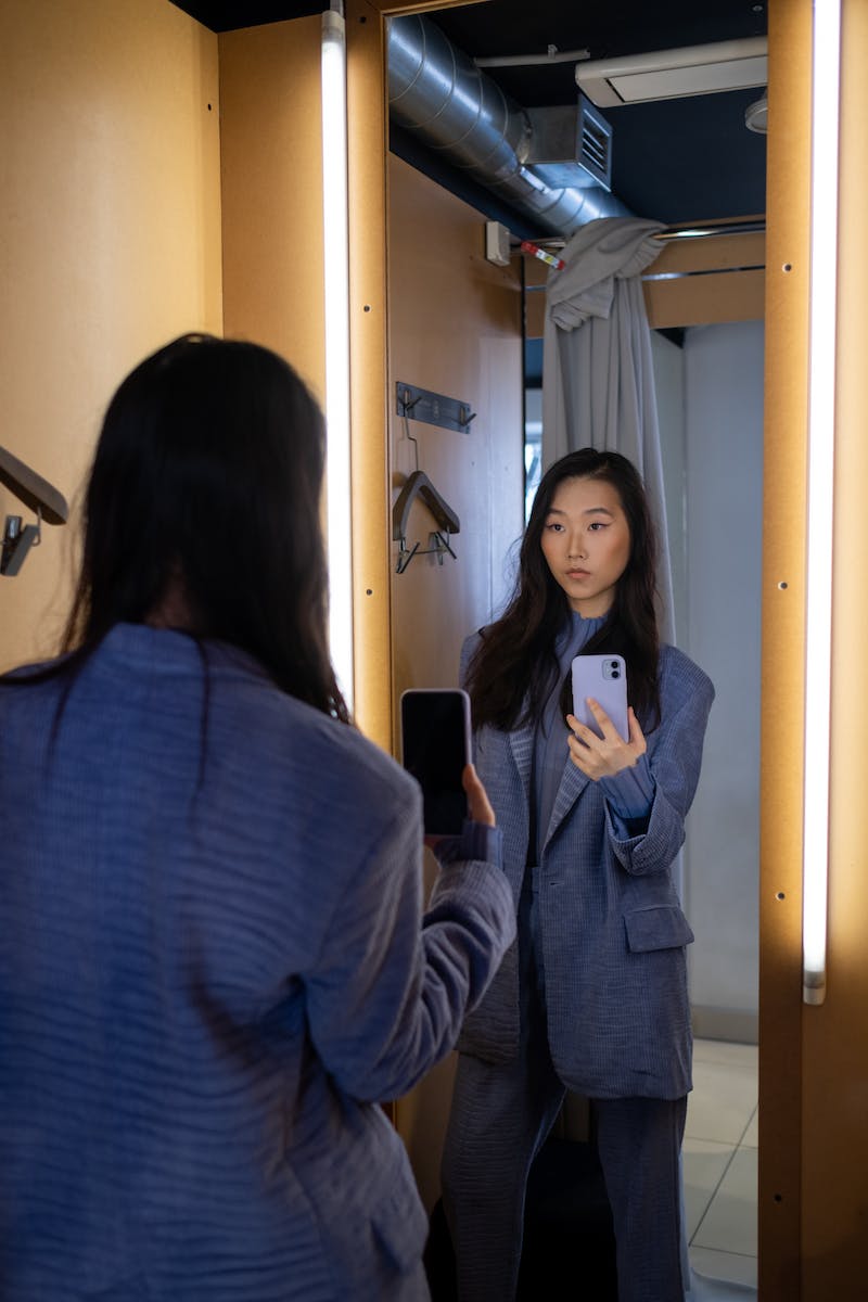 Woman in Blue Blazer in the Fitting Room