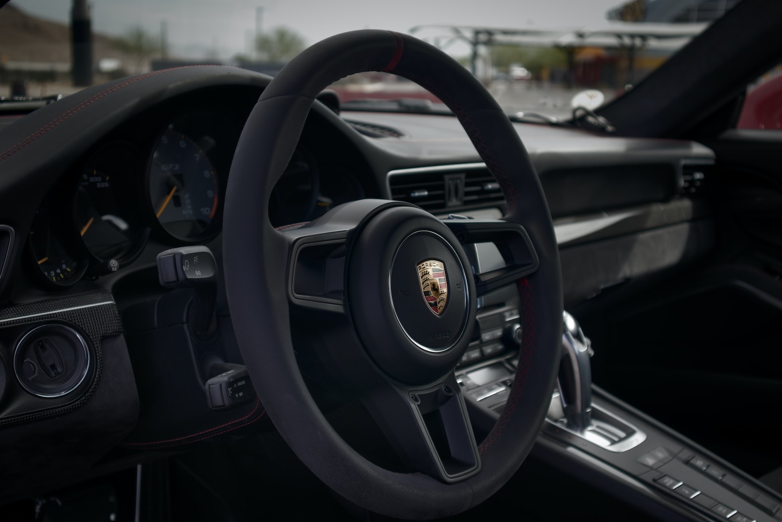 a close up of a steering wheel and dashboard of a car