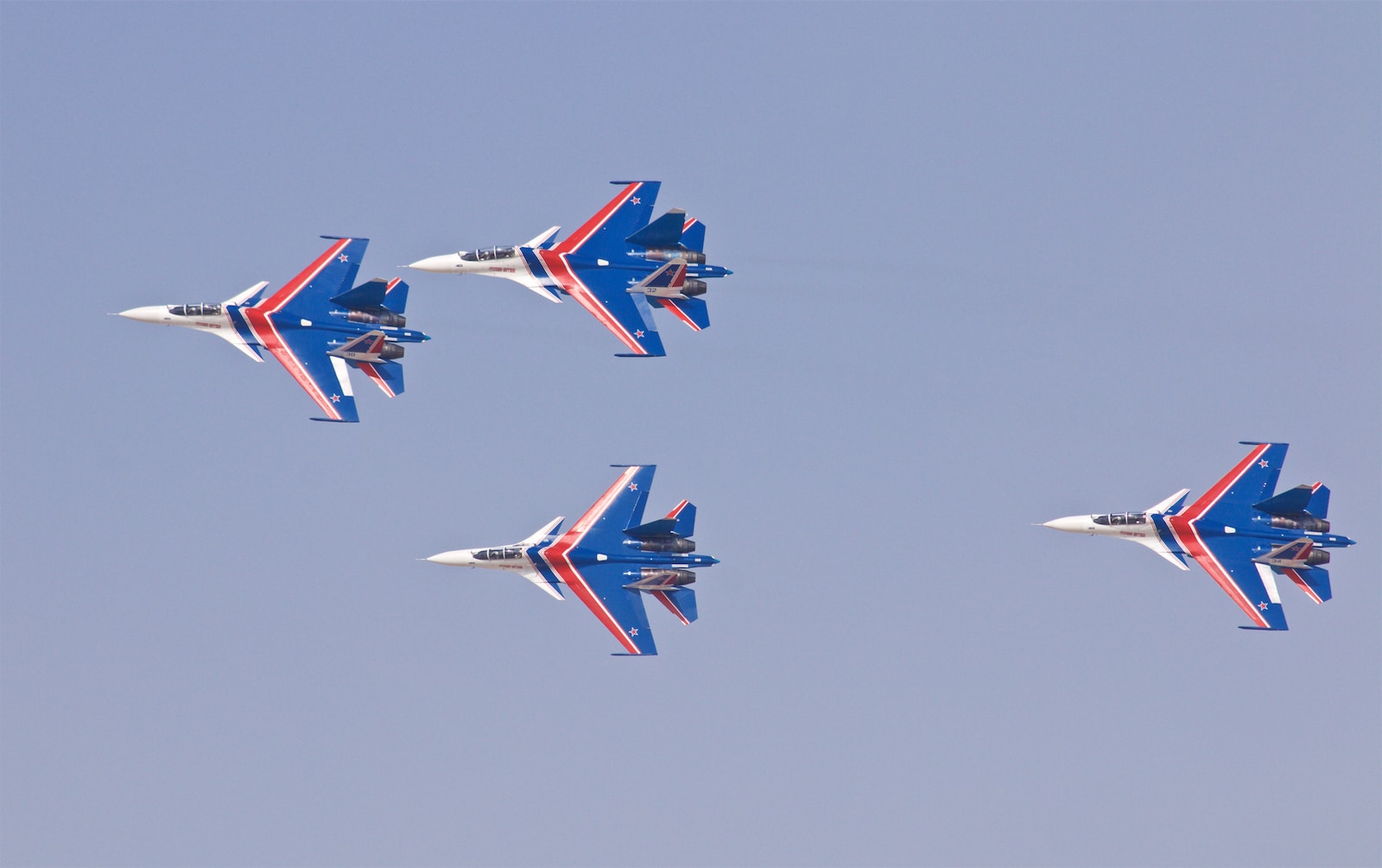 four blue jet planes