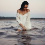 woman posing in body of water