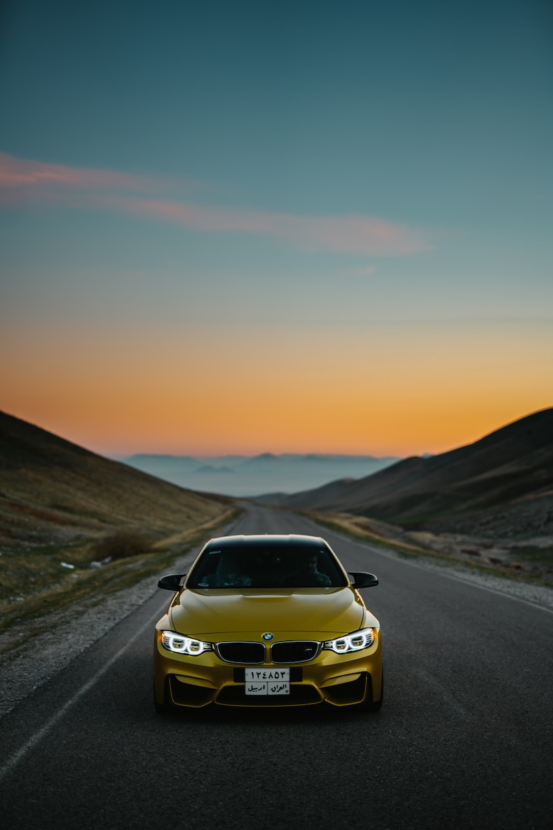 yellow BMW car on road