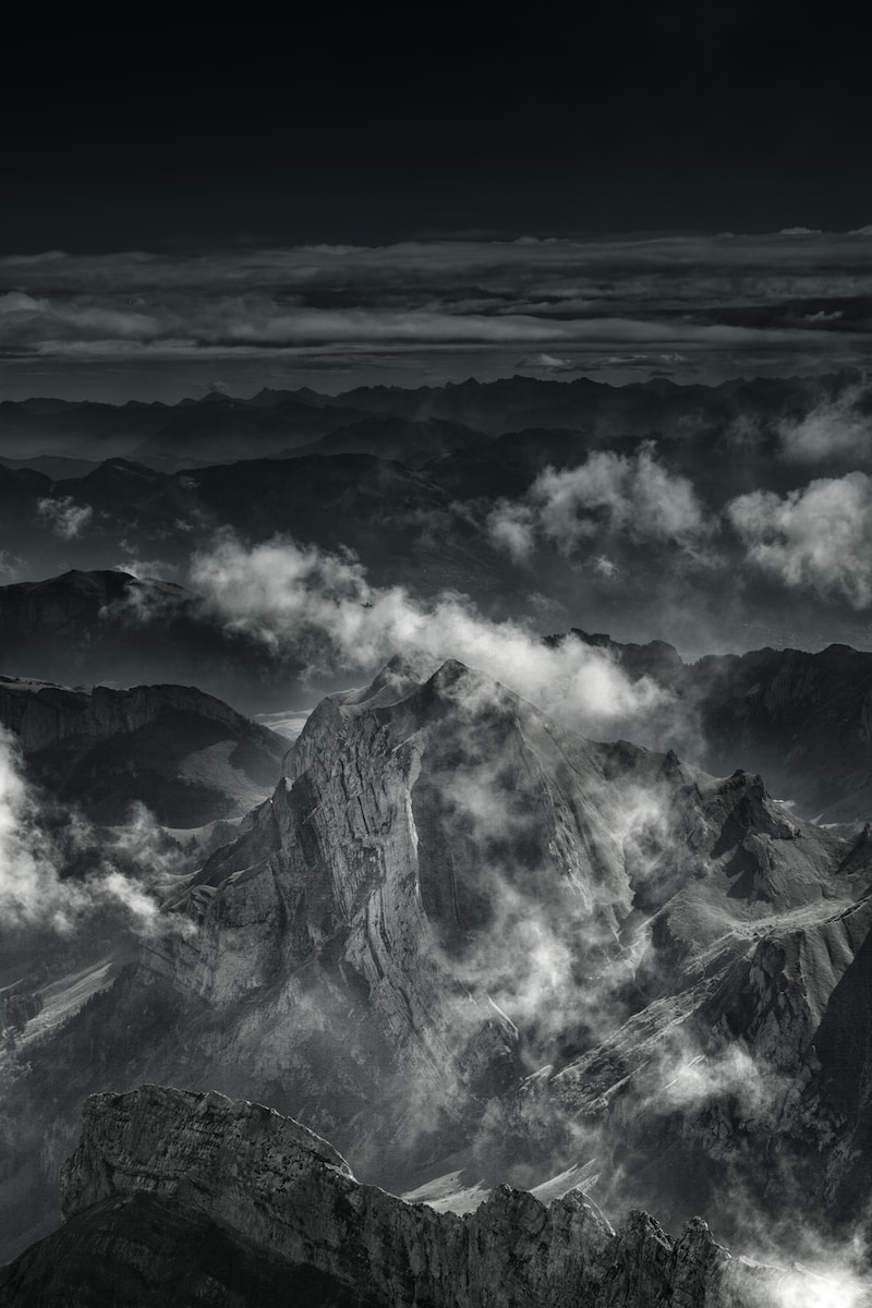 grayscale photo of mountain range