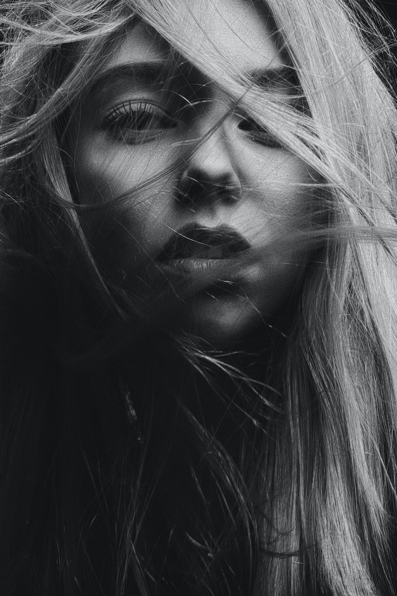 grayscale photography of woman's face